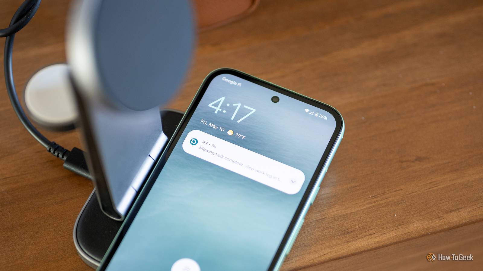 Google Pixel 8a sitting on a wireless charger