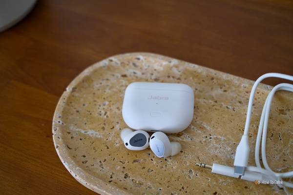 Jabra Elite 10 Gen 2 in white laying on a table