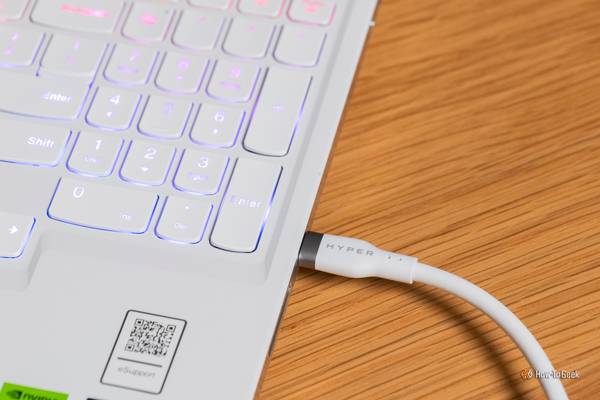 The HYPER HyperJuice 240W Silicone USB-C to USB-C Cable plugged into a laptop