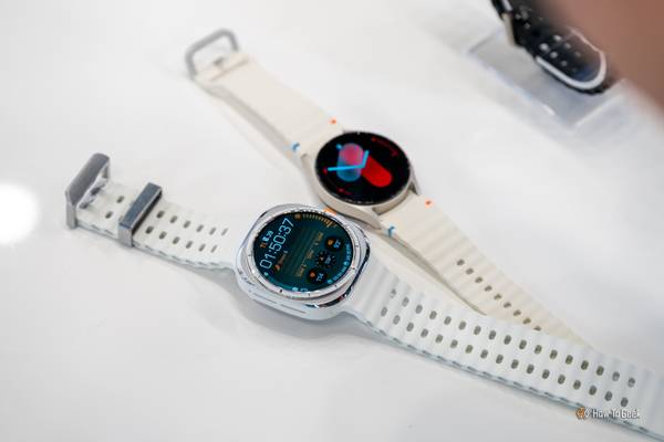 Samsung Galaxy Watch Ultra sitting on a table next to the Samsung Galaxy Watch 7