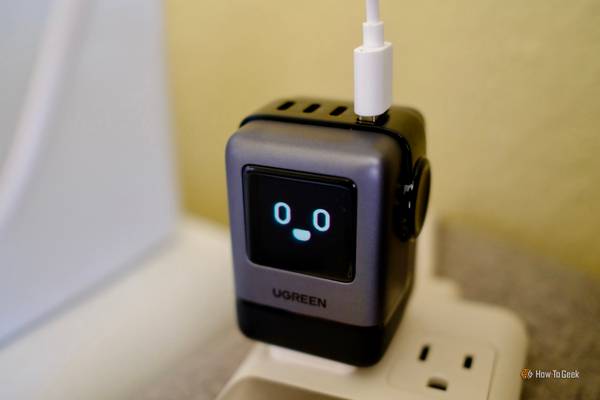 Ugreen Uno Charger 100W plugged in and charging