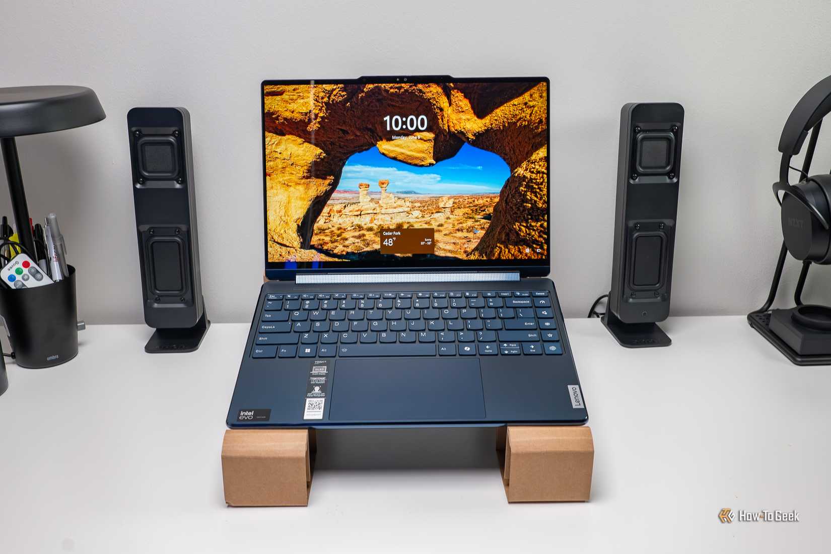 The Lenovo Yoga 9i 2-in-1 Gen 9 on the included cardboard as a laptop stand.