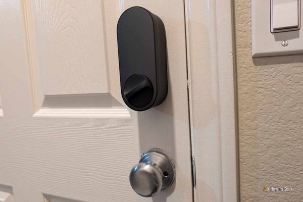 Black Aqara Smart Lock U200 installed on door and locked