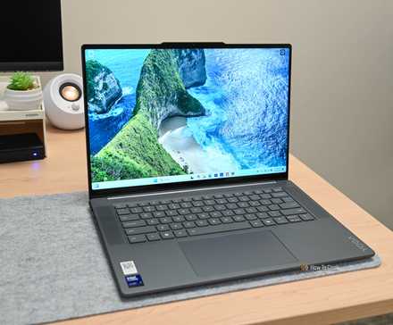 The Lenovo Yoga Slim 7i Aura Edition opened to the Windows 11 home screen.