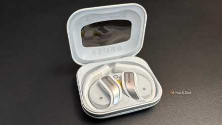 1MORE S70 Open Earbuds sitting in the charging case.