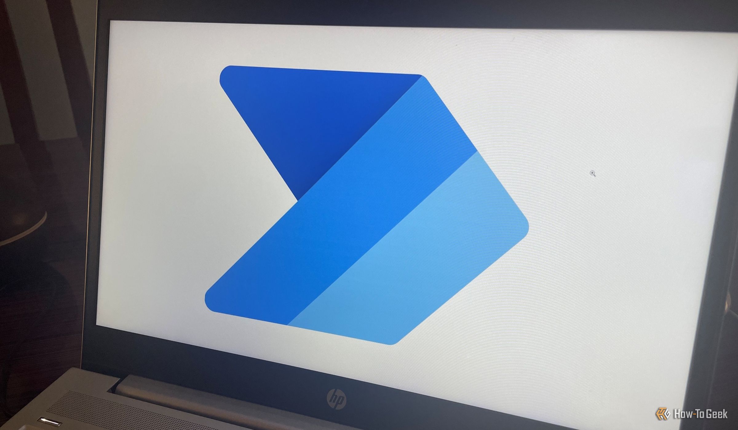 The Power Automate app logo on a laptop.