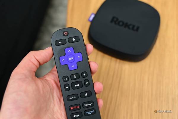 Person using the Voice Remote Pro with the Roku Ultra.