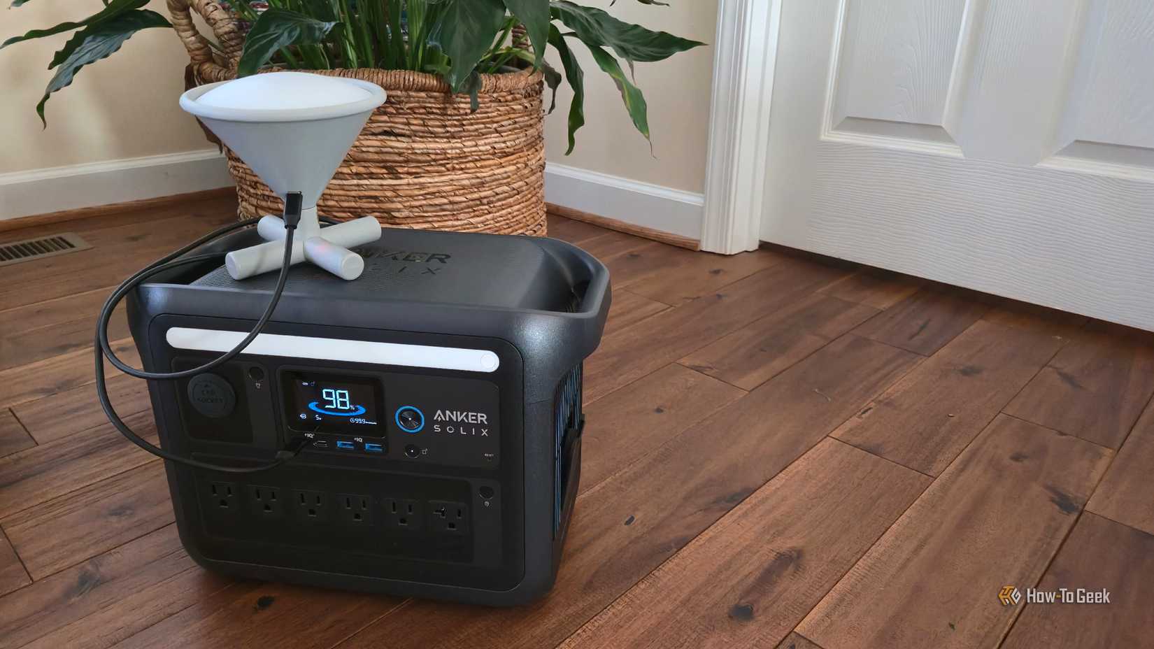 An Umbra Cono smart lamp plugged into an Anker C1000.