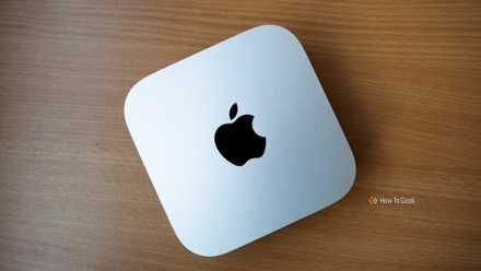 the Tesla Top rate Connectivity selection an M4 Mac Mini sitting on a wooden table.