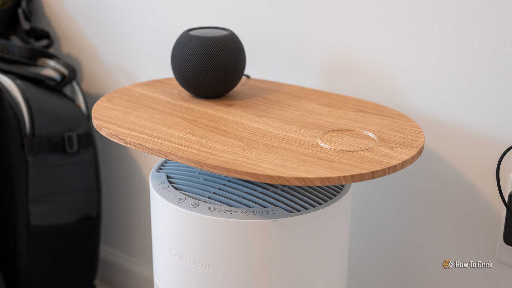 SwitchBot Air Purifier Table with a HomePod Mini sitting on top.