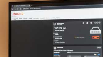 The Unraid dashboard opened on a computer monitor showing the logo and some server statistics.