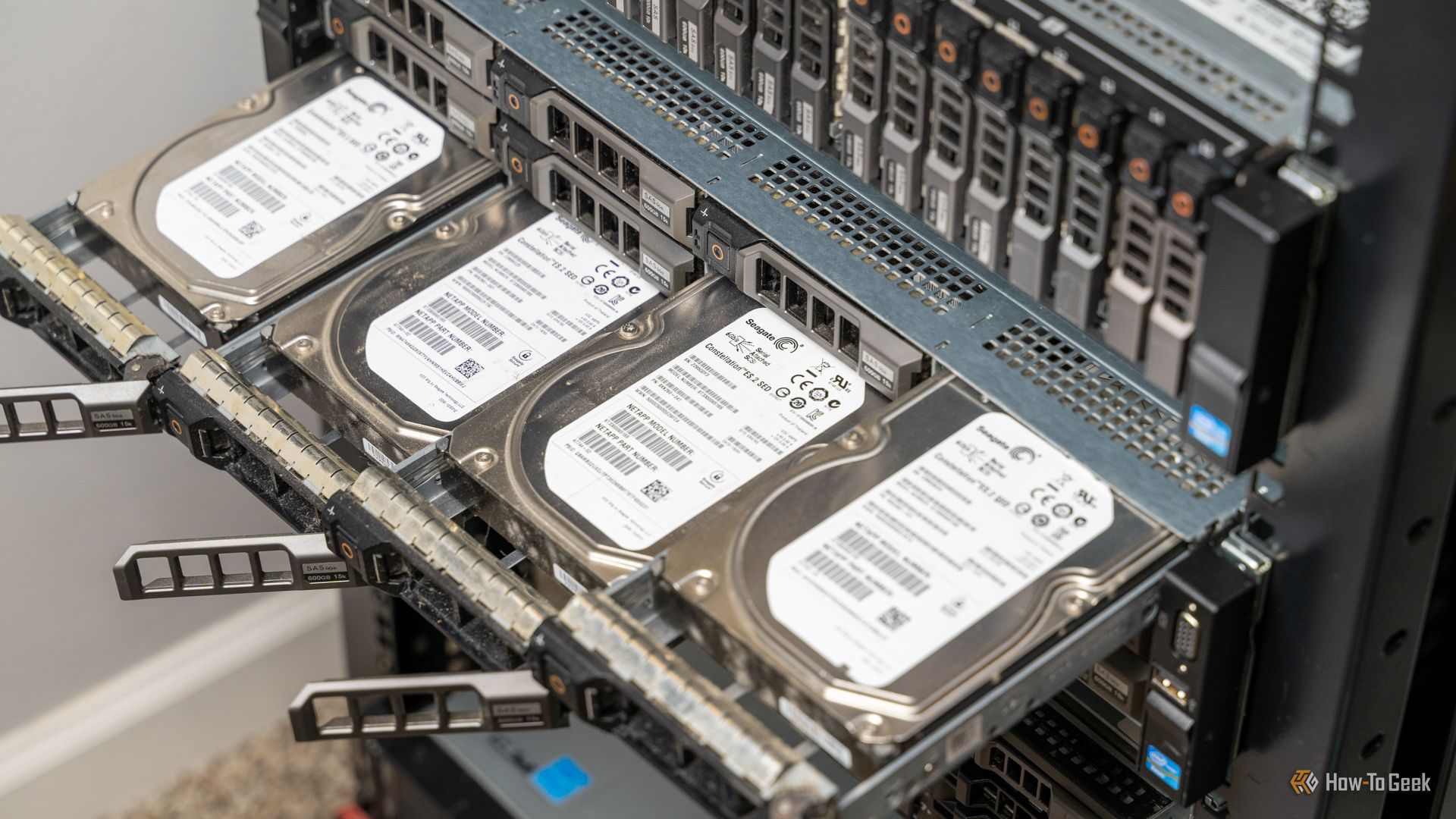 Four hard drivers sticking out of a rack-mount server that's being used as a NAS.
