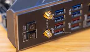 The back panel I/O of a motherboard showing USB ports and Wi-Fi antenna connectors,.