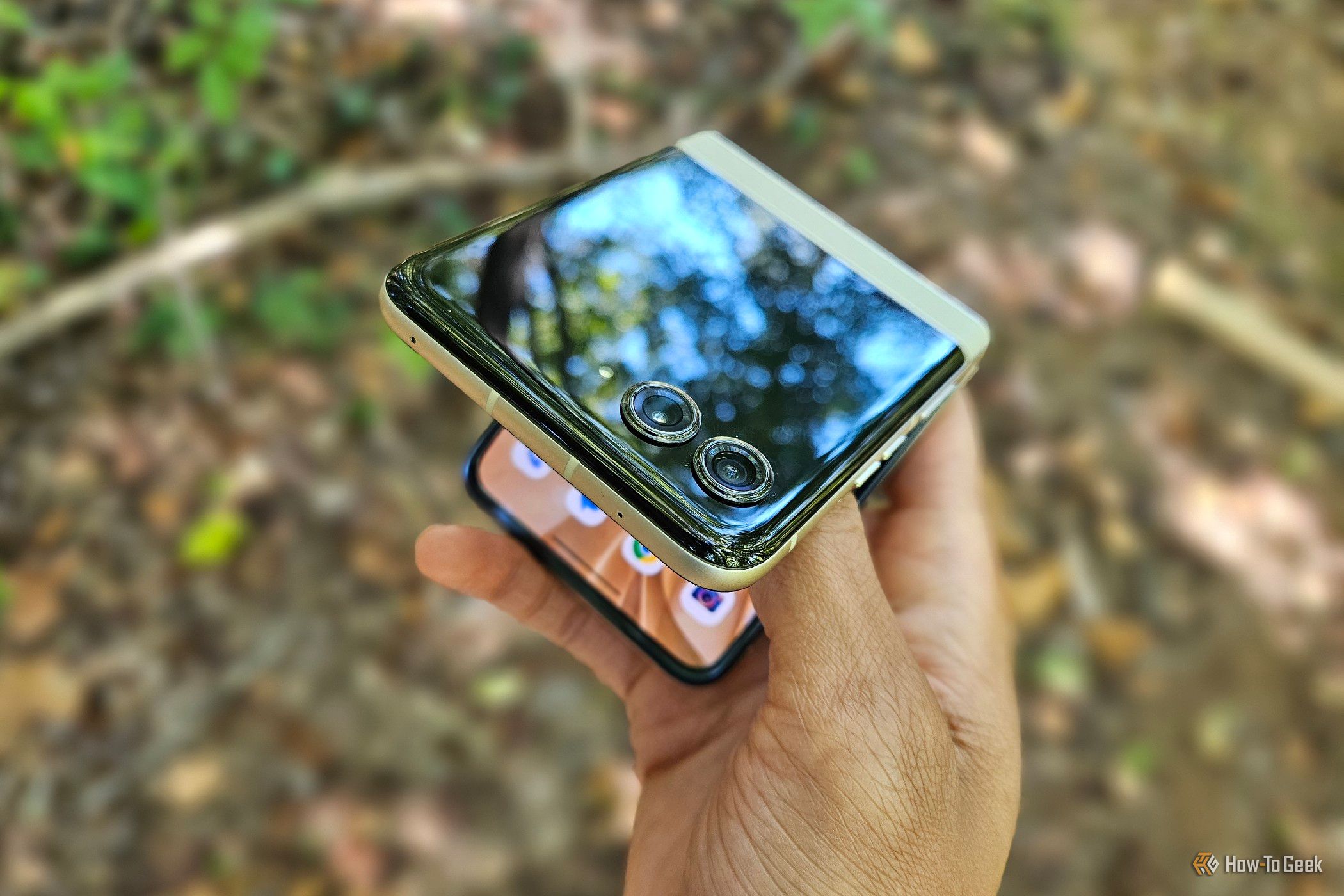 A hand trying to unfold a Motorola Razr 2024.