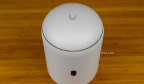 A top-down view of the Unifi Dream Router 7 with the Unifi logo visible.