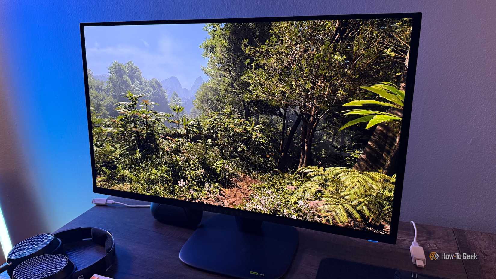 A jungle in Indiana Jones on an Alienware 27 4K QD-OLED (AW2725Q).