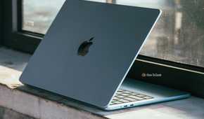 M4 MacBook Air in Sky Blue in darker scene on ledge.