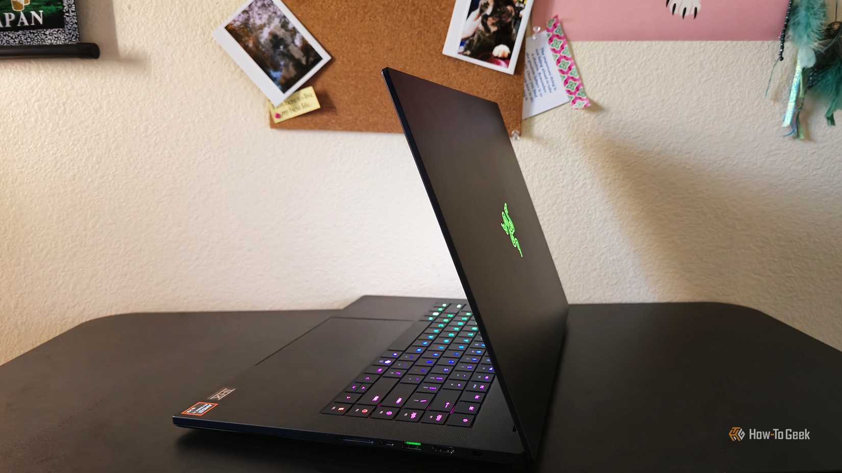 The Razer Blade 16 2025 gaming laptop's side view on a desk.