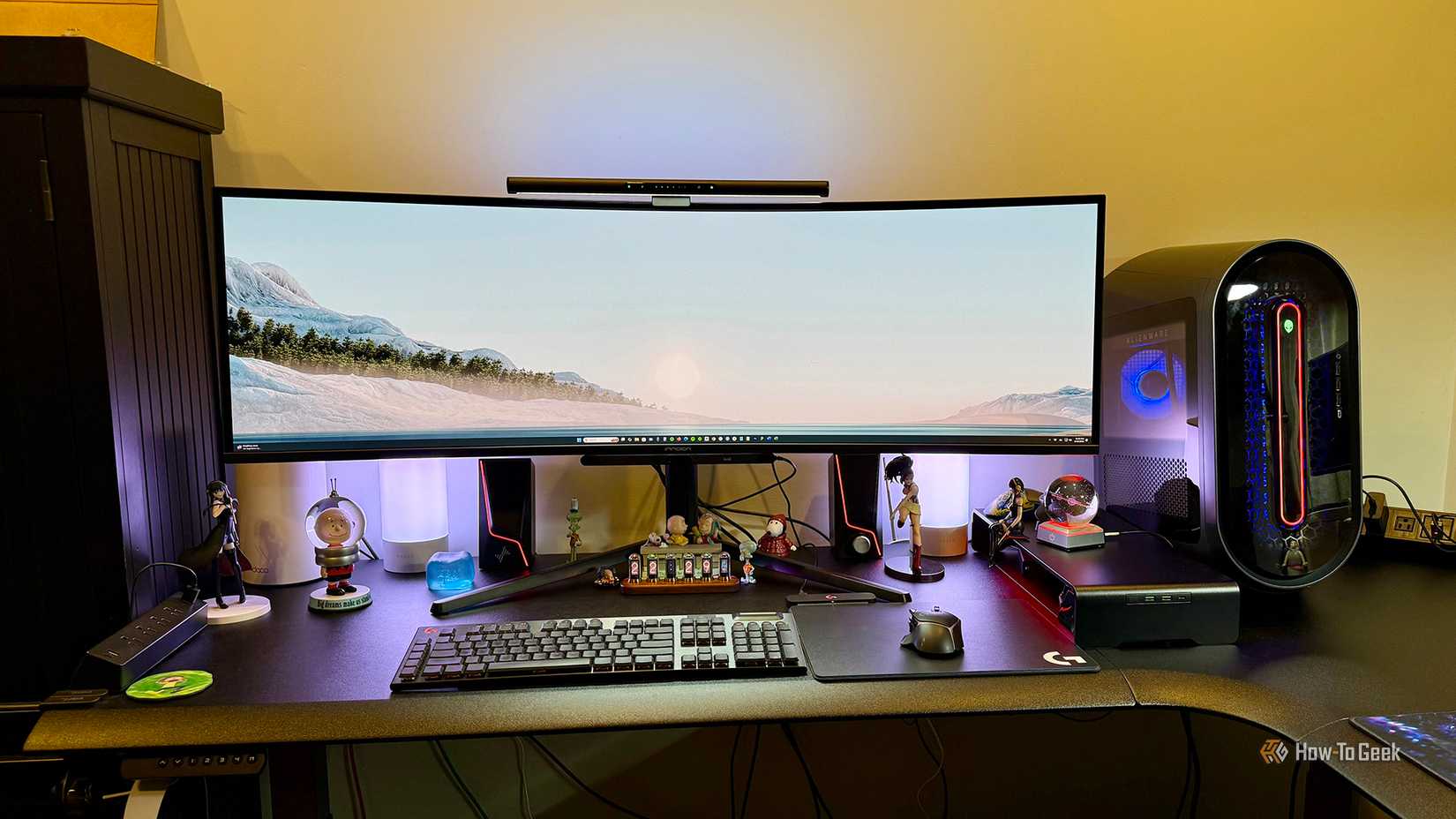 INNOCN 49Q1R 49-Inch OLED Curved Gaming Monitor on a desktop with accessories.