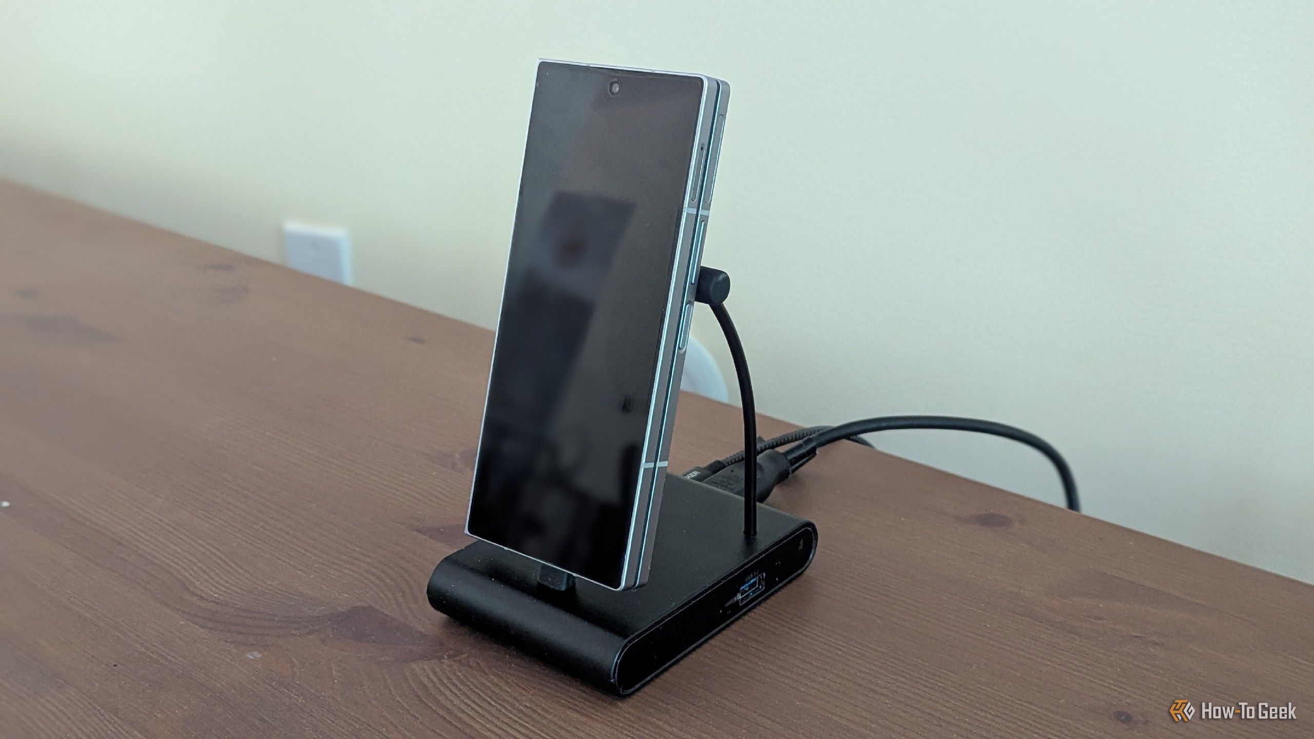 A Samsung Galaxy Z Fold 6 on a phone dock.