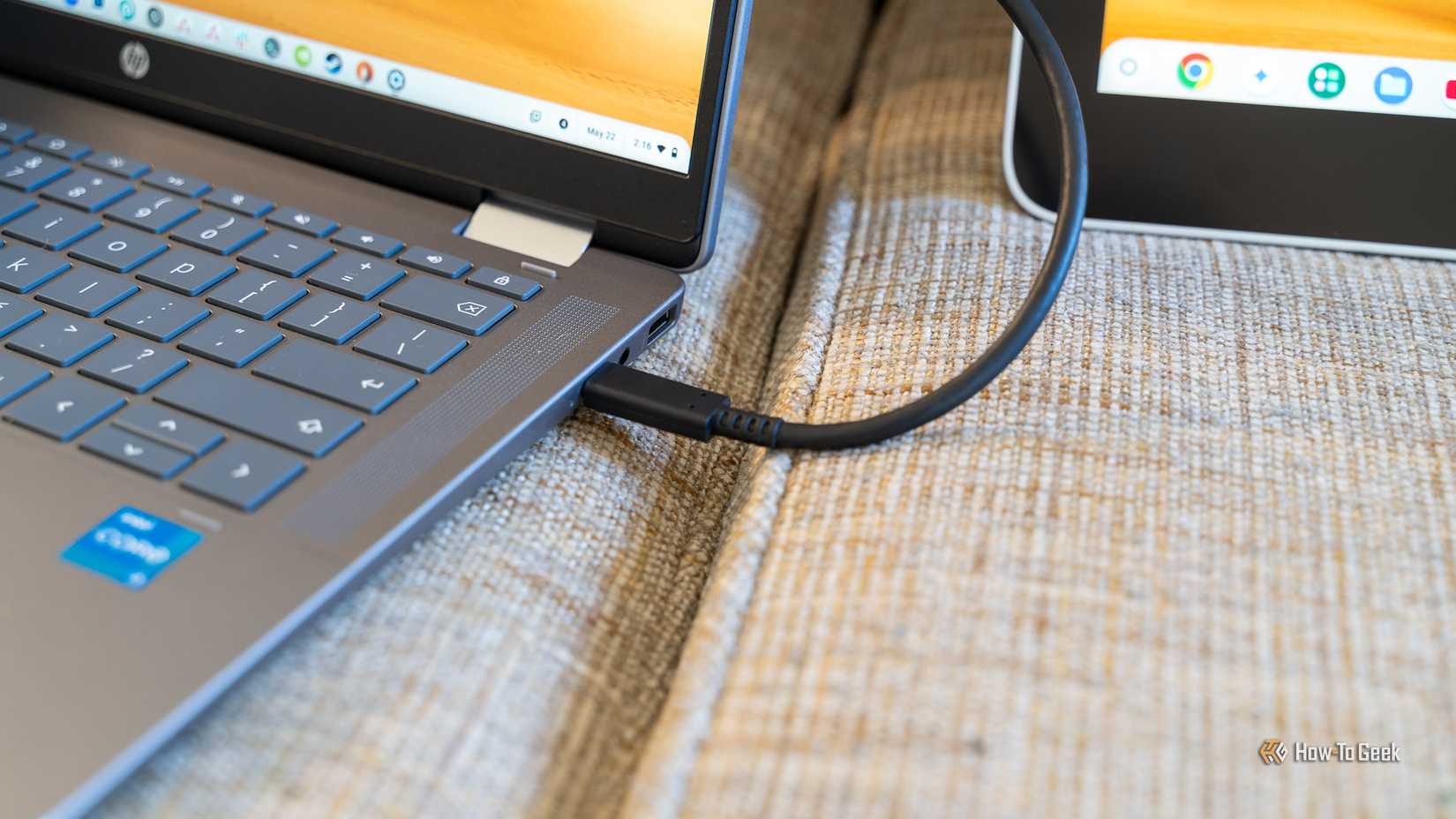 A USB-C cable connected to both a Chromebook and Wacom drawing tablet.
