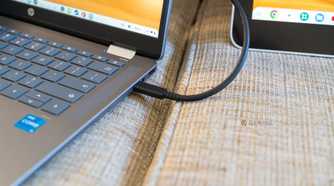 A USB-C cable connected to both a Chromebook and Wacom drawing tablet.