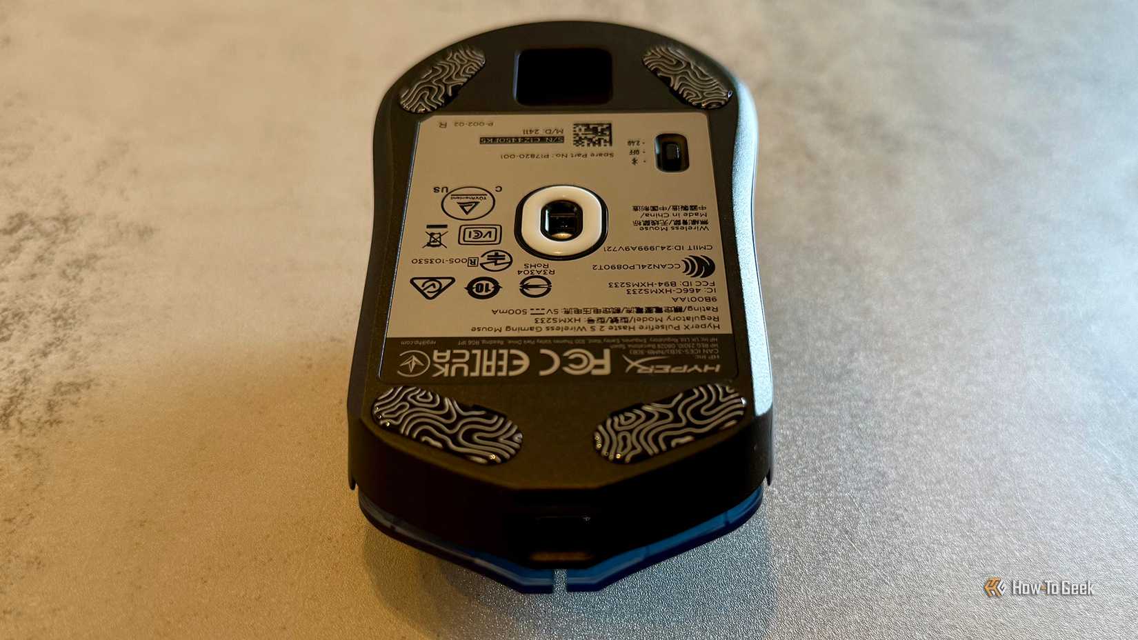 The underside of the HyperX Pulsefire Haste 2 S wireless gaming mouse.