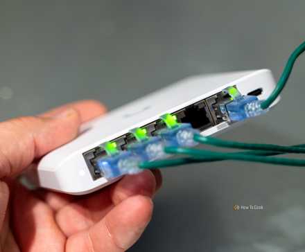 The ports on the Unifi Flex Mini 2.5G Ethernet switch with the link lights illuminated.
