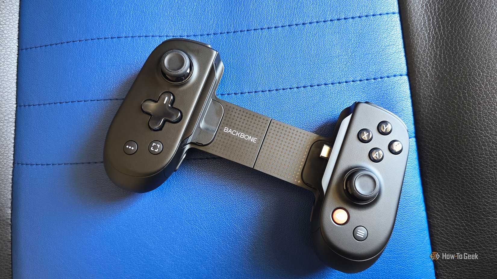 The Backbone Pro controller on a gaming chair.