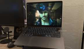 Cyberpunk 2077 is running on a MacBook.