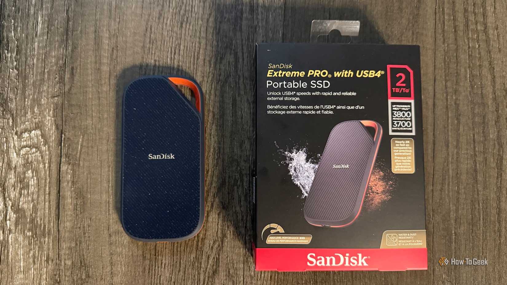 The SanDisk Extreme PRO Portable SSD with USB4 and its box on a table.