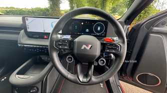 Close-up shot of the steering wheel in a 2025 Hyundai Ioniq 5 N.