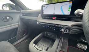 Close-up shot of the center console and infotainment screen in a 2025 Hyundai Ioniq 5 N.