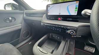 Close-up shot of the center console and infotainment screen in a 2025 Hyundai Ioniq 5 N.