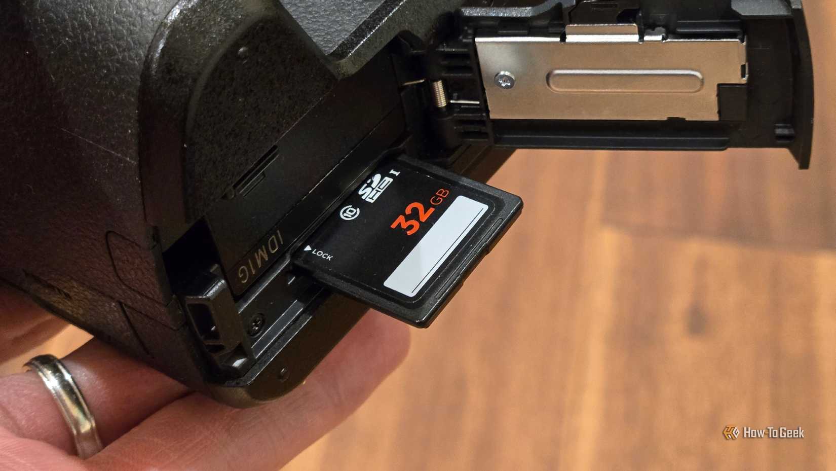 A full-size SD card in a Panasonic Lumix G7 mirrorless camera.
