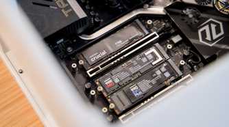 The Crucial T710, Samsung 9100 Pro, and Samsung 990 EVO Plus NVMe SSDs installed in a gaming desktop.