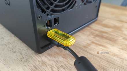 Flash drive plugged into the USB-A port on the back of a Synology DS425+ NAS.-2