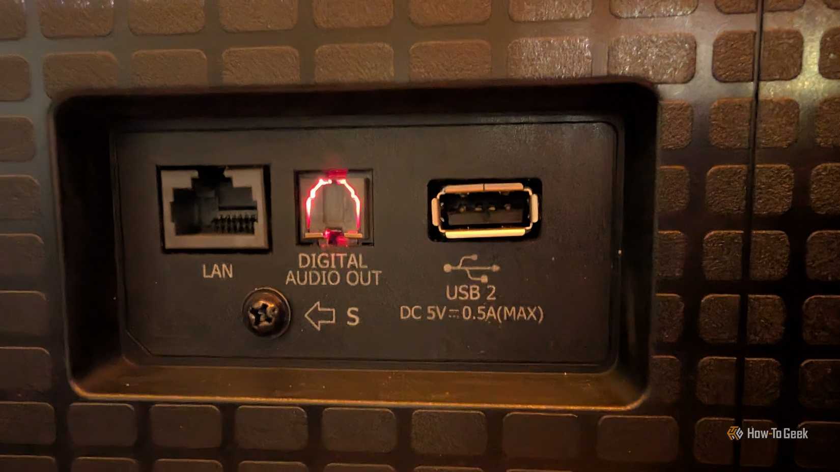 A USB port, an optical port, and an Ethernet port.