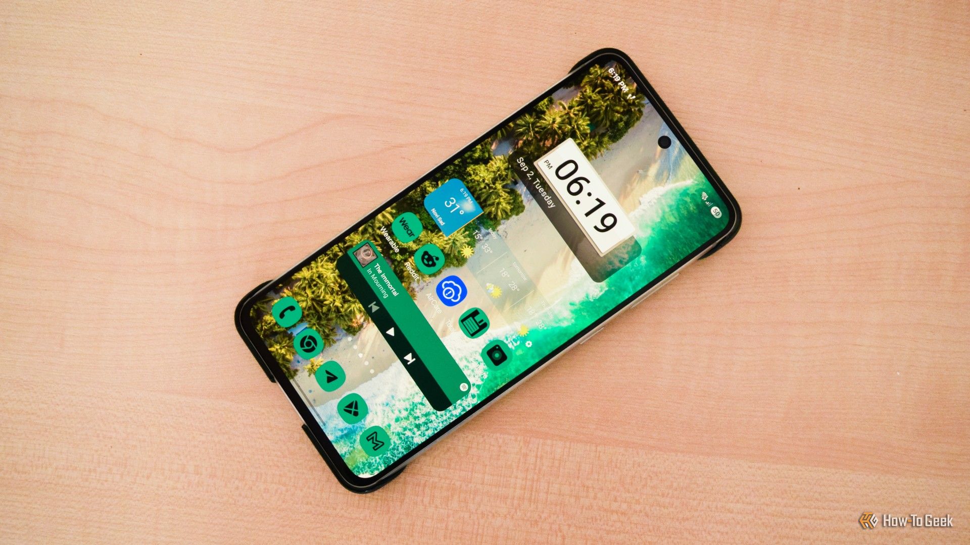 A Samsung S21 FE Laying on a table.