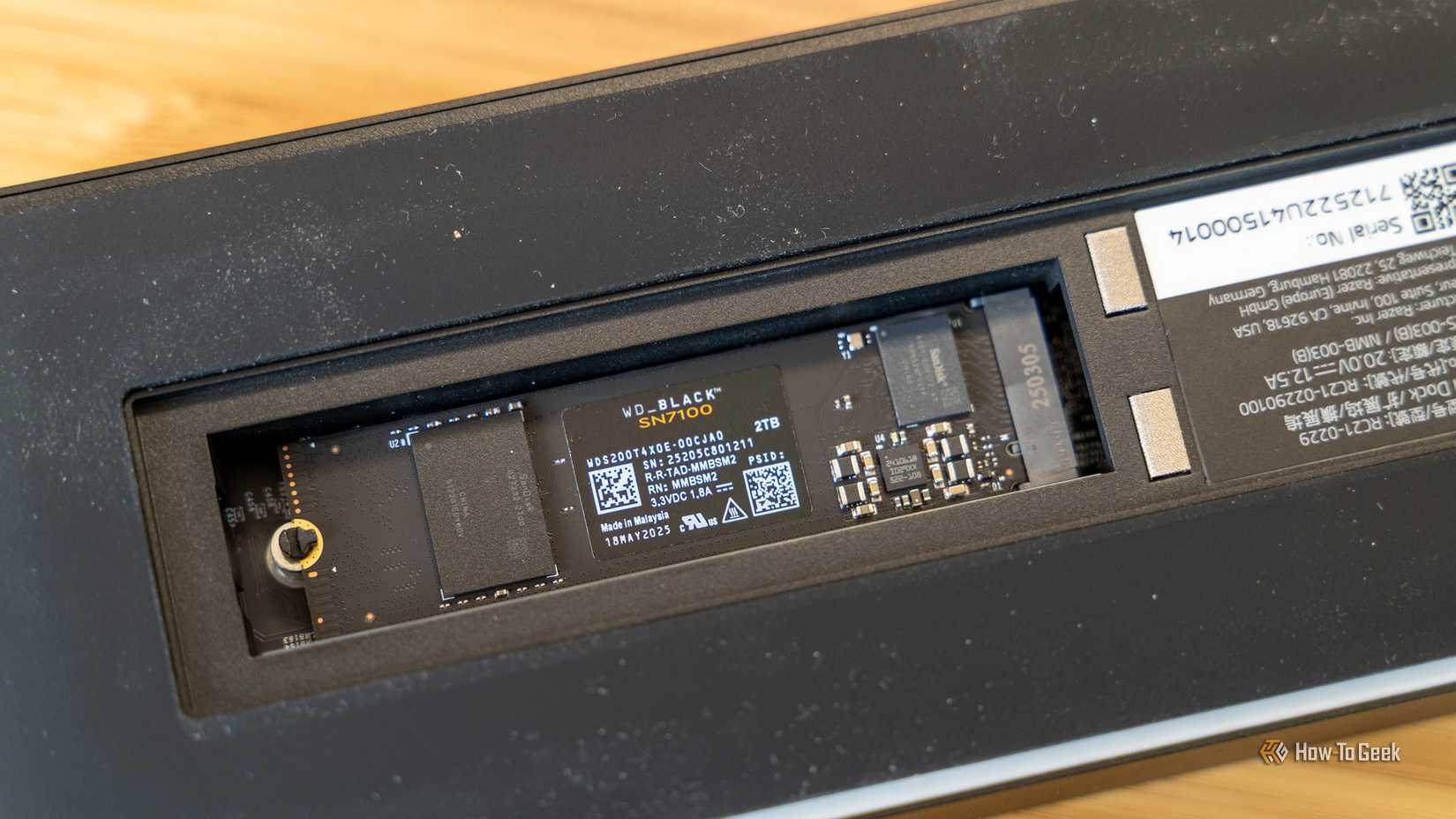 An NVMe SSD inserted into the bottom of the Razer dock. 