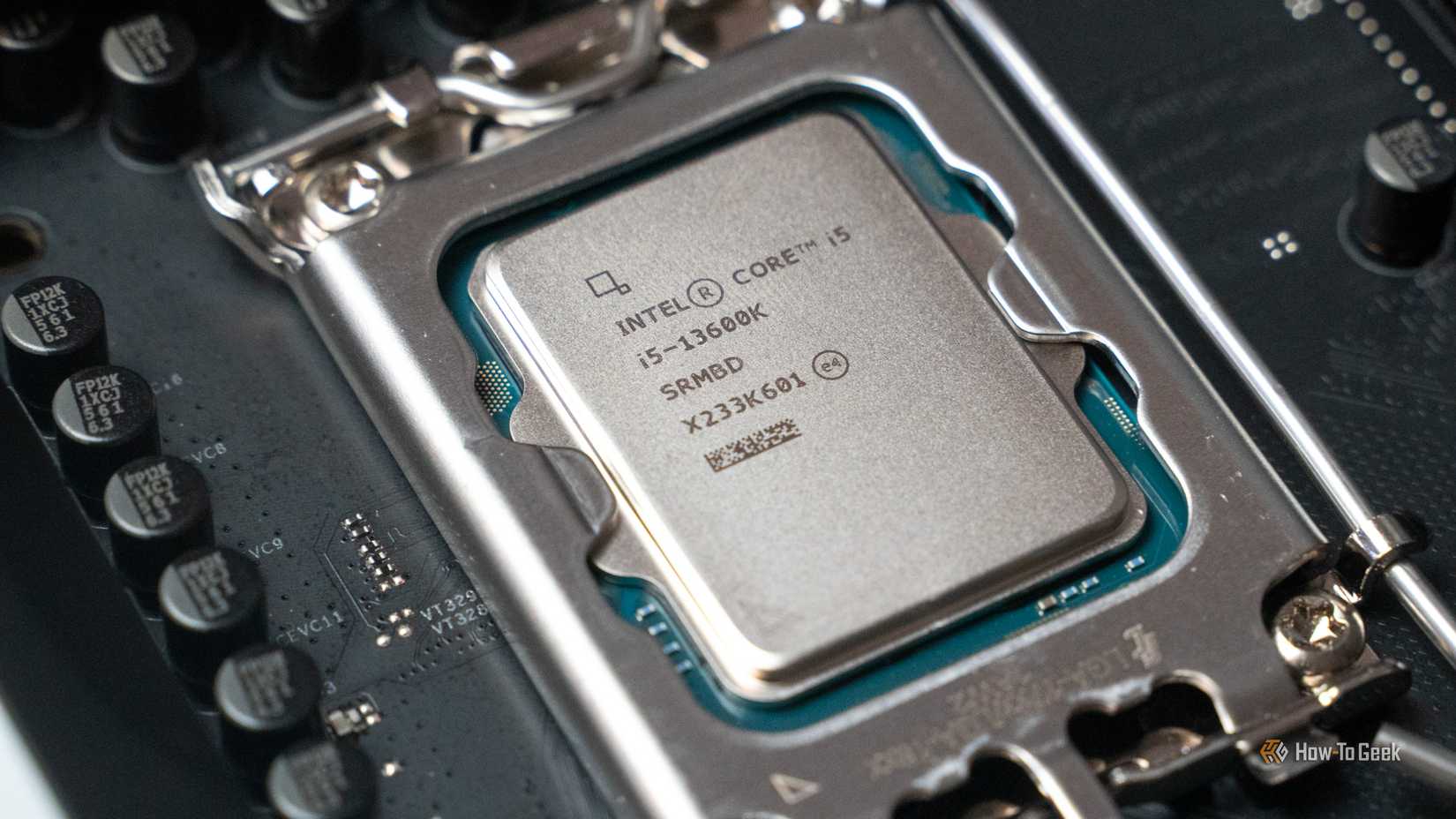 The Intel i5-13600K processor seated on a motherboard.