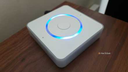 Home Assistant Voice Preview Edition on a shelf with lights activated