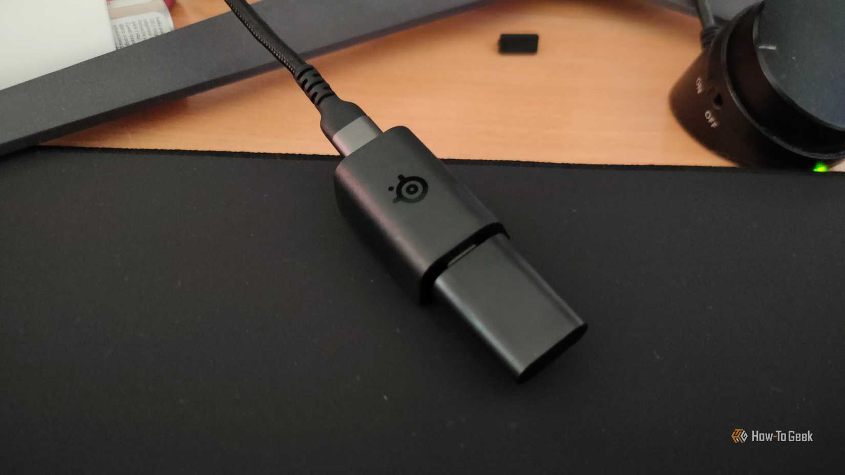 A SteelSeries 2.4GHz dongle for a wireless keyboard.