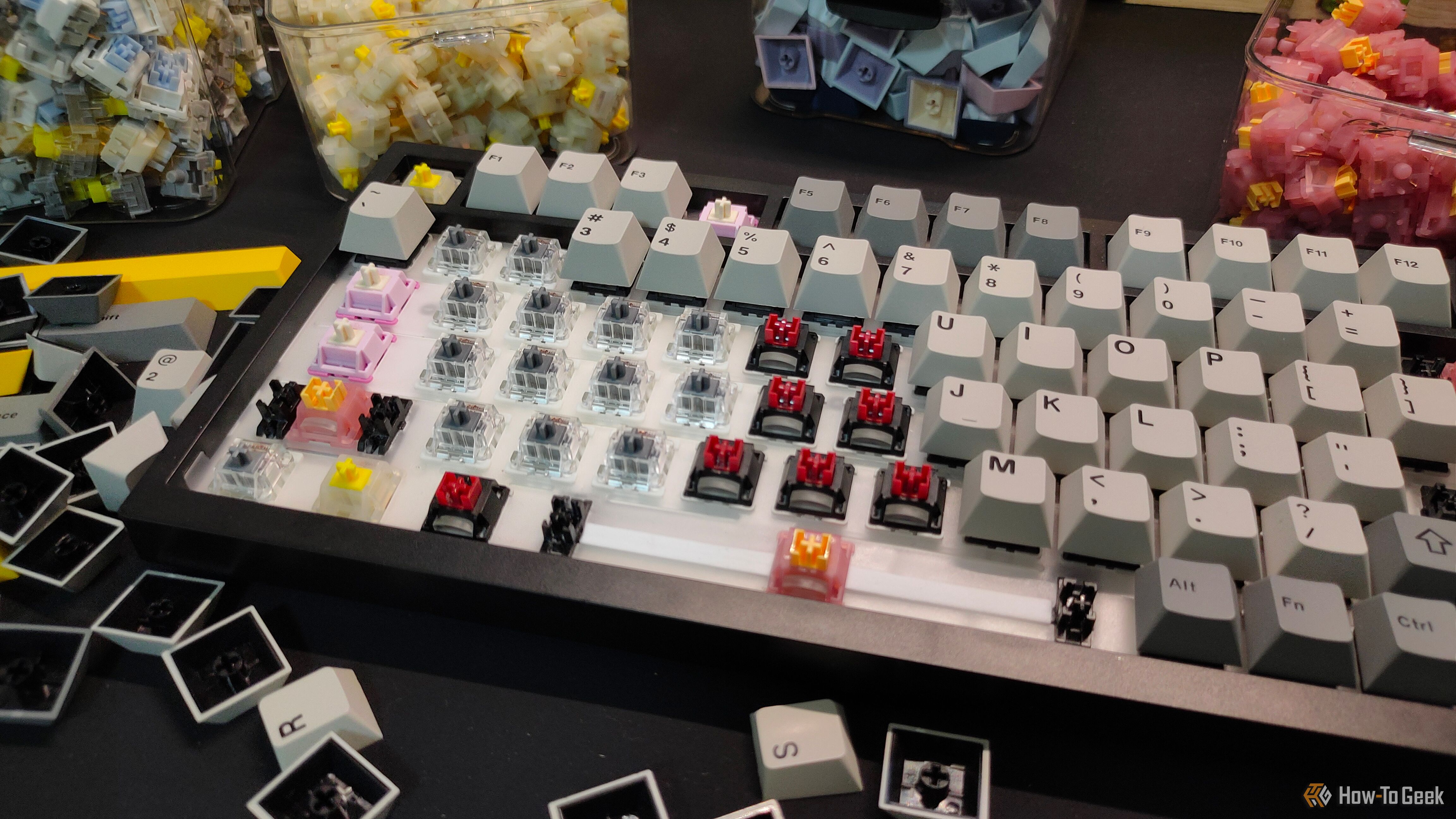 A mix of different keyboard switches on the Ajazz AK820 mechanical keyboard.