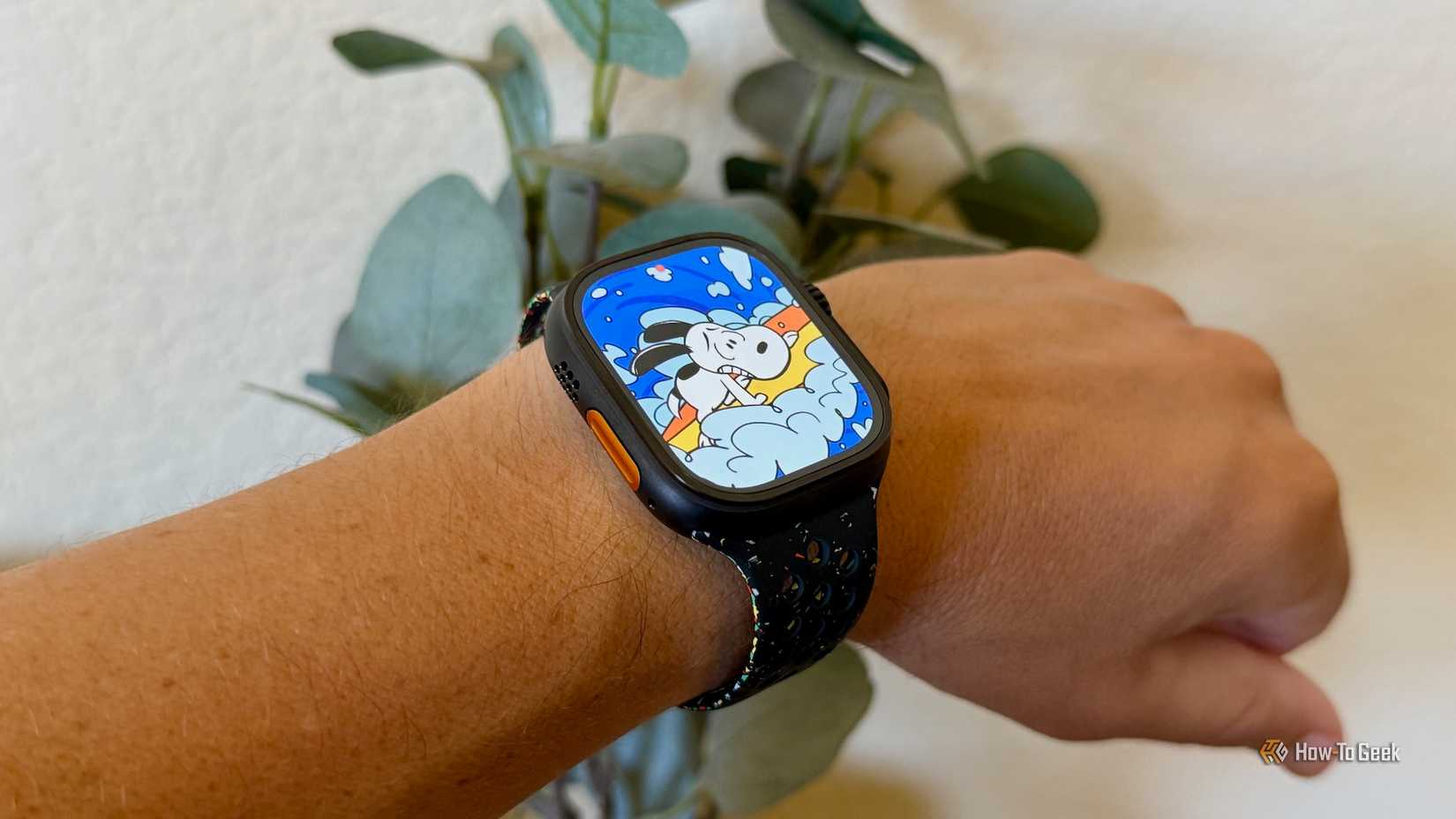 Apple Watch Ultra 3 showing Snoopy on the face.