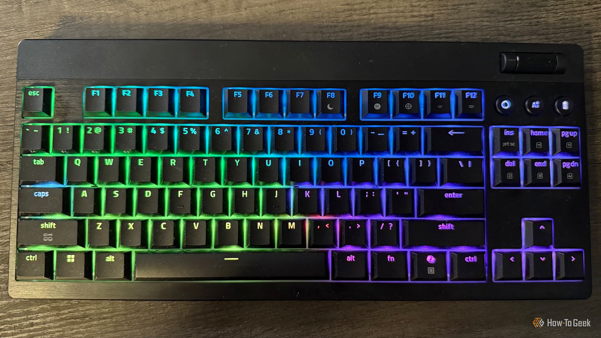The Razer BlackWidow V4 Low-Profile Tenkeyless HyperSpeed from above with RGB lighting.