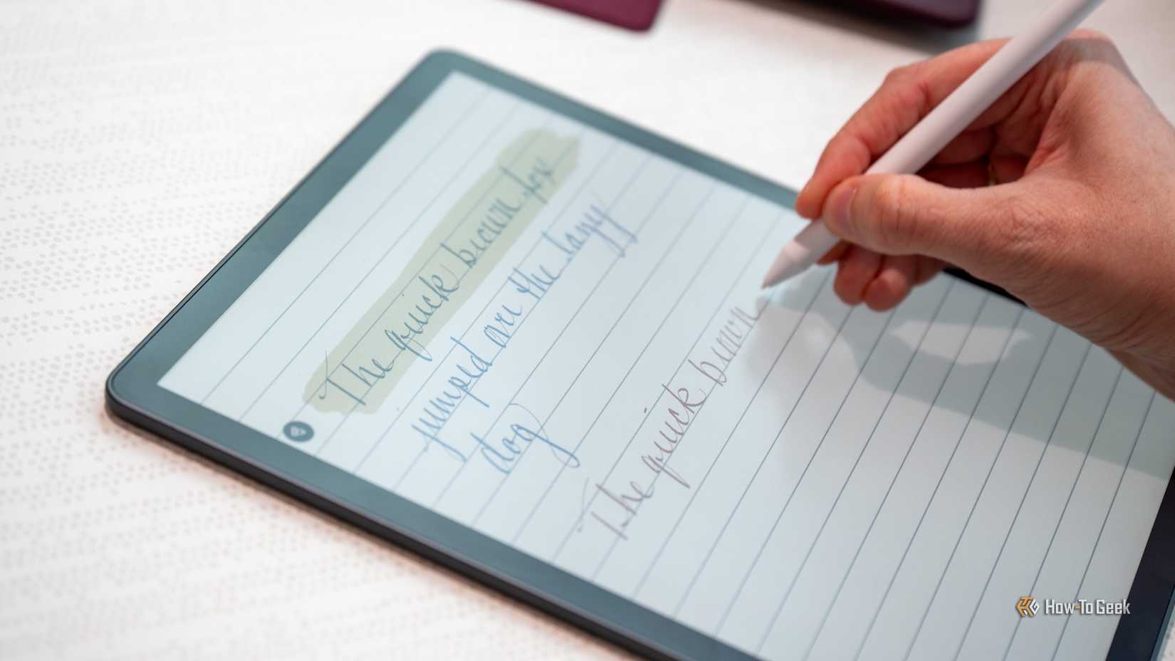Person writing on the Amazon Kindle Scribe Colorsoft.
