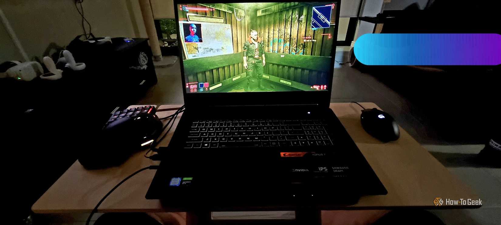 Playing Cyberpunk 2077 on a Gigabyte Aorus 7 gaming laptop.