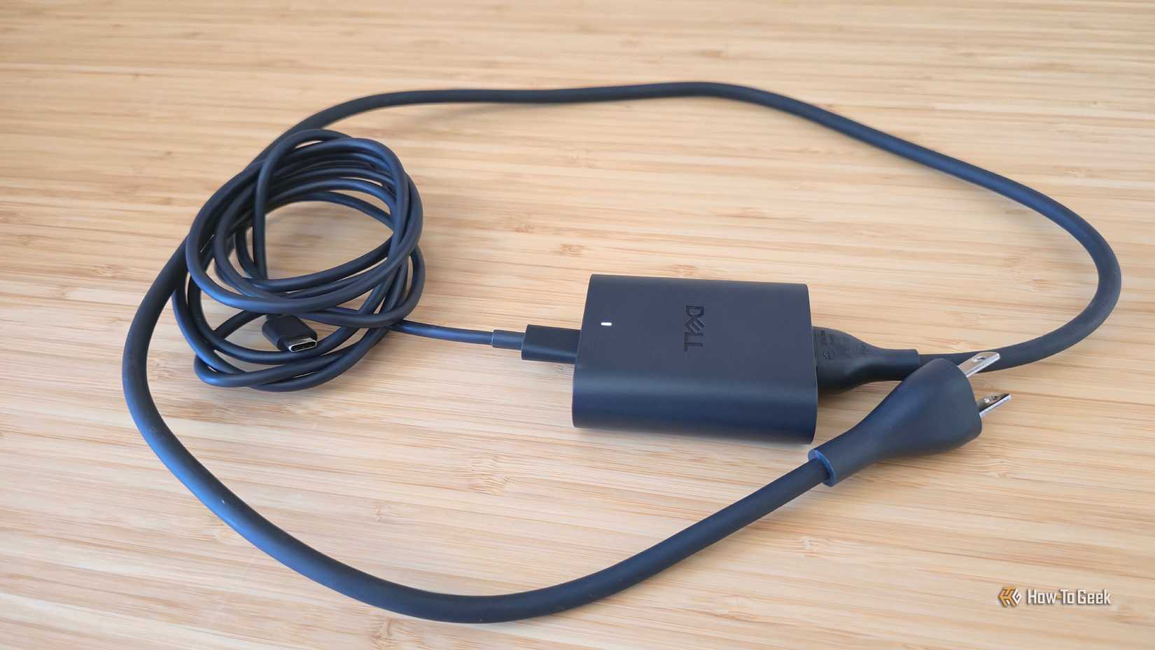 The AC adapter for the Dell 14 Premium (DA14250) laptop.