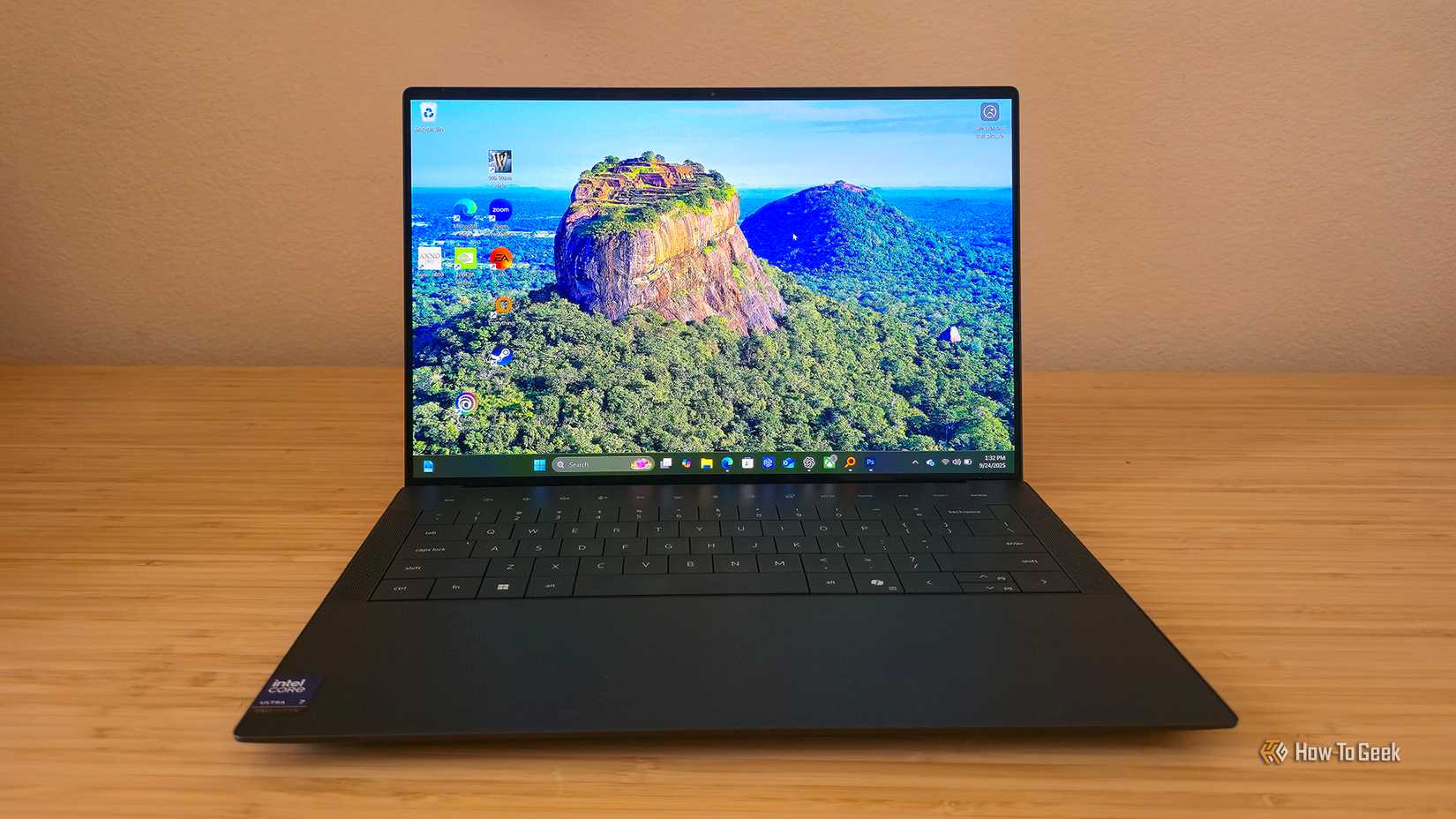 The Dell 14 Premium (DA14250) laptop sitting open on a desk.